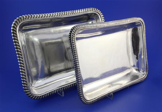 Two pairs of late Victorian silver entree dish bases by Mappin & Webb, 11.5in & 10.5in.